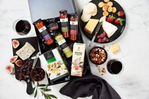 Gourmet cheese and cracker hamper with wine.