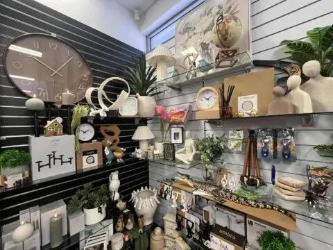 Home decor items and clocks displayed on store shelves